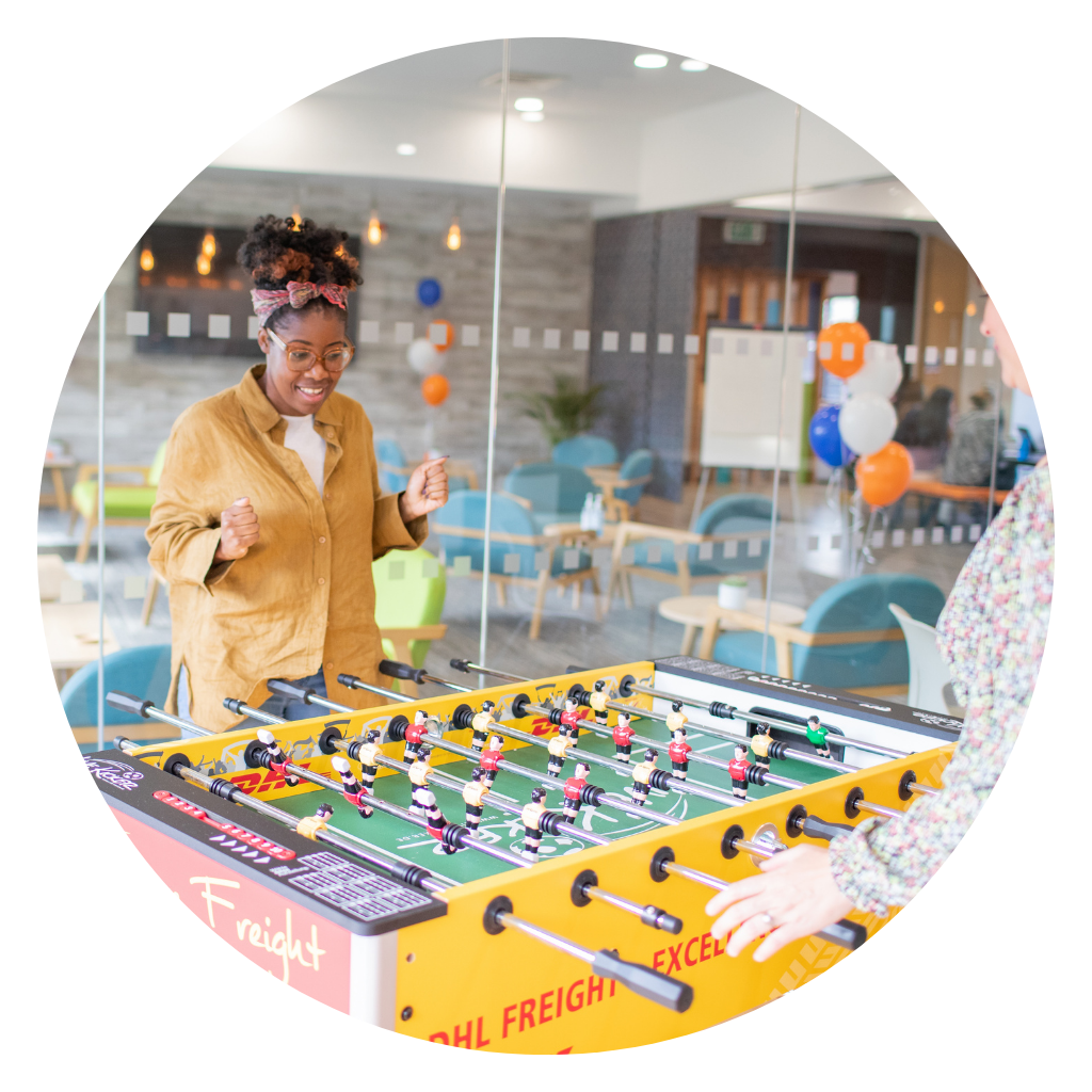 Employees playing table football