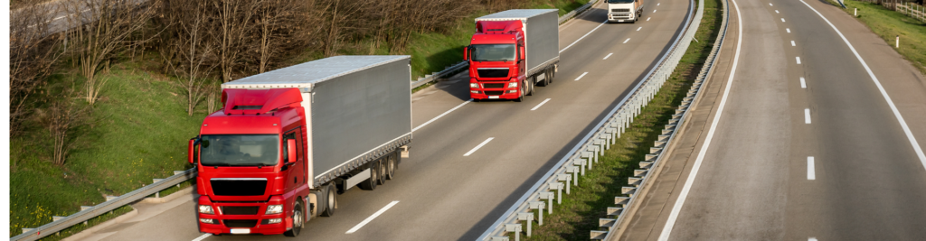 A photo of a truck and trailer driving down the motorway