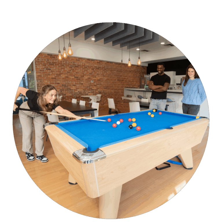 Graduates playing pool