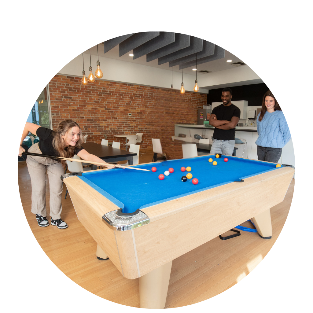 Graduates playing pool