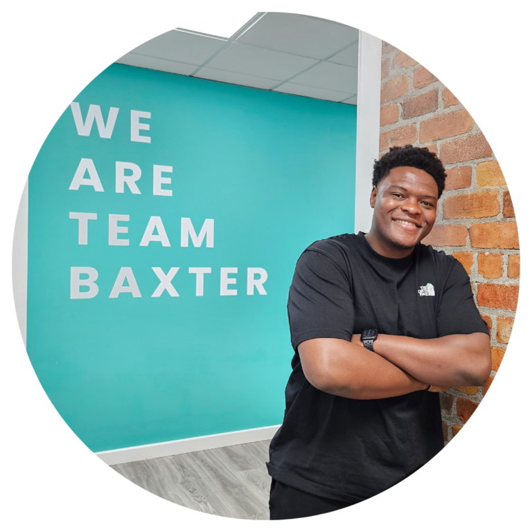 Phil Bilson in front of the We Are Team Baxter Wall