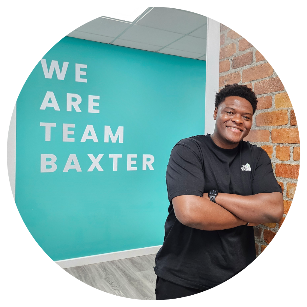 Phil Bilson in front of the We Are Team Baxter Wall